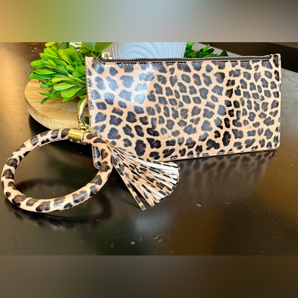 NIB leopard print bracelet wallet with tassel.
